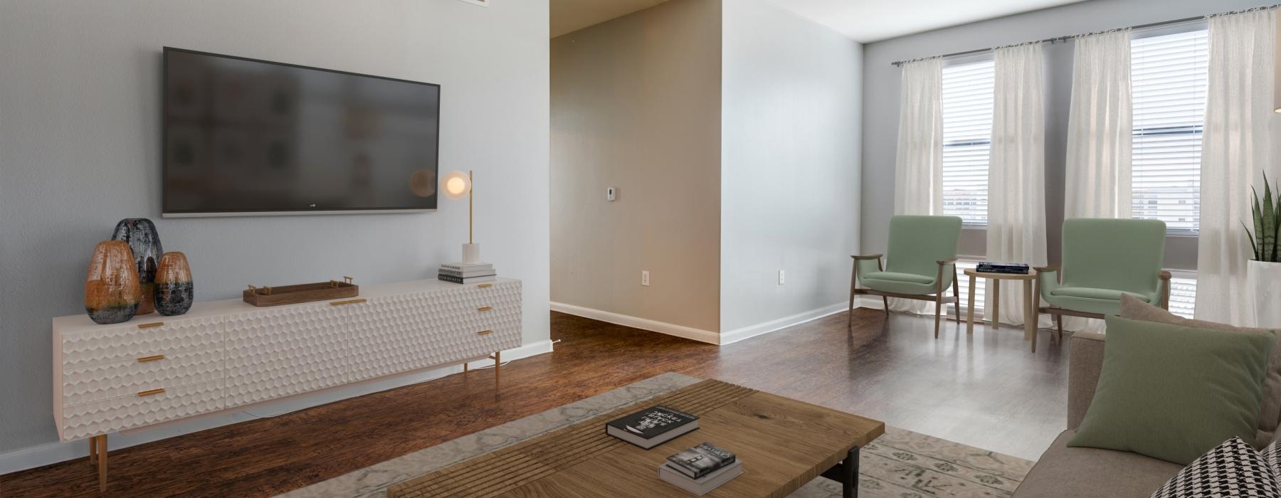 a living room with a bed and a tv