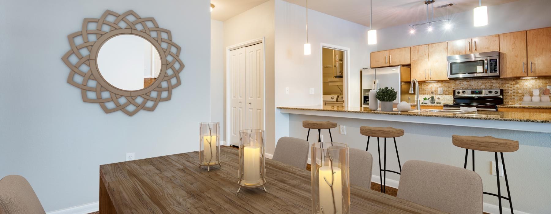 a kitchen with a table and chairs