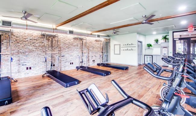 Cutting-edge amenities at your fingertips a gym with exercise equipment