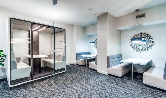 Settle into comfort at Lofts at City Centre semi-private work spaces with bright lighting